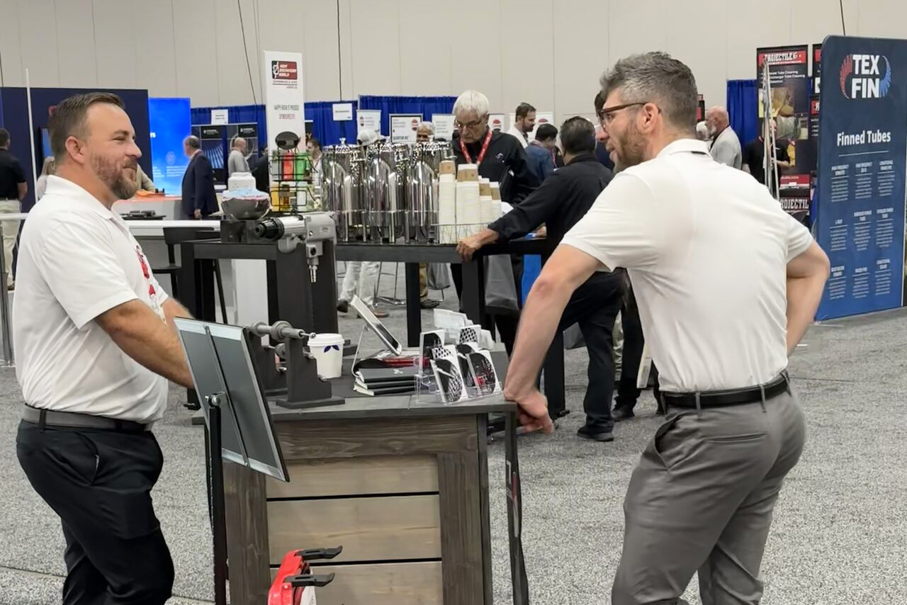 Booth w Customer – cropped Heat Exchanger World