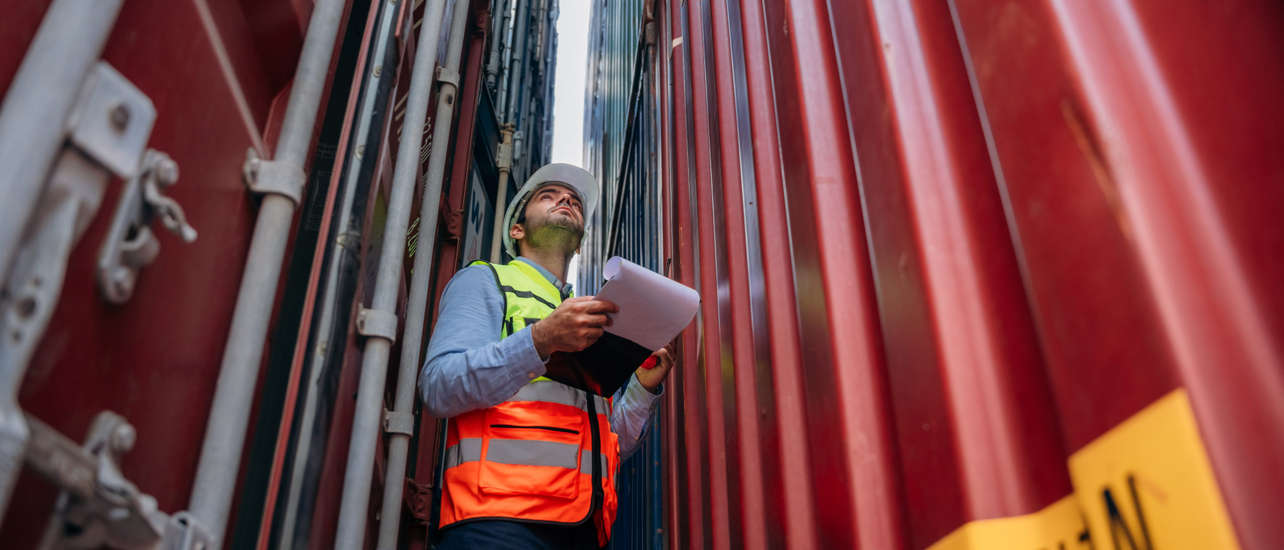 Industrial Engineer checking inventory or task details at Container cargo harbor. Logistics Expert Overseeing Shipping and Distribution Operations. Sales Project Specialist Dayton, Ohio